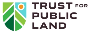 Logo of Trust for Public Land featuring a green shield with leaves and a sun icon.