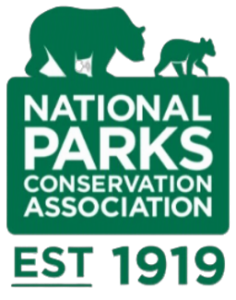 Logo of the National Parks Conservation Association featuring a bear, a small animal, and the founding year 1919.