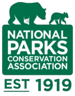 Logo of the National Parks Conservation Association featuring a bear, a small animal, and the founding year 1919.